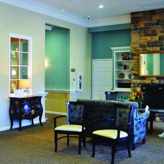 A cozy living room with comfortable seating and a fireplace.