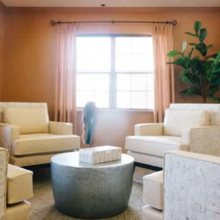 A cozy living room with modern furniture and natural lighting.