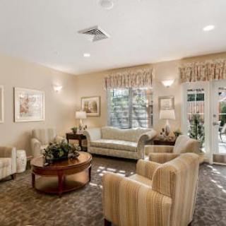 A cozy living room with elegant furniture and soft lighting.