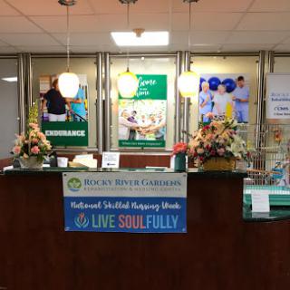 A welcoming reception area featuring health-related signage and floral decorations.