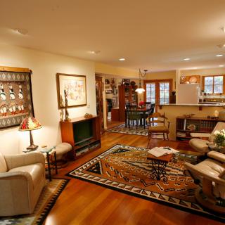 A cozy living room with wooden floors and elegant decor.