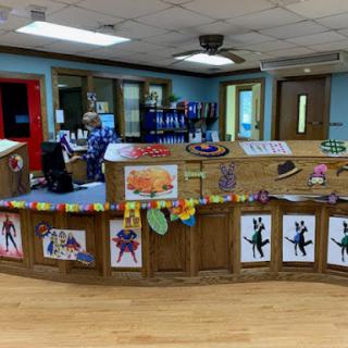 A vibrant reception area featuring colorful decorations and children's artwork.