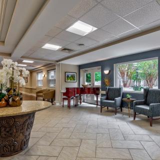A well-lit lobby with seating and decorative elements.