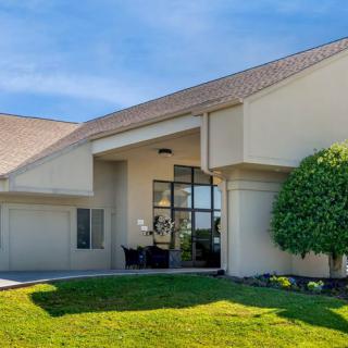 Modern residential house with a well-maintained lawn.