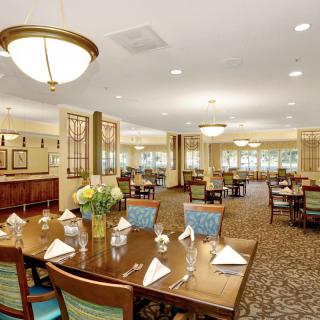 An elegant dining room with well-arranged tables and classic decor.
