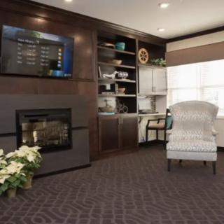 A modern living room with a cozy fireplace and elegant furnishings.