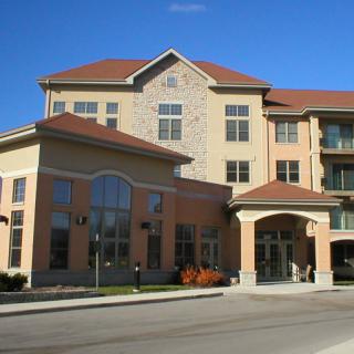 A multi-story residential building with modern architectural design.