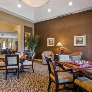 A cozy dining area with elegant furniture and warm lighting.