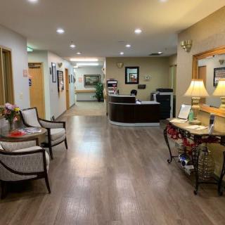 An inviting lobby with a reception desk and comfortable seating area.