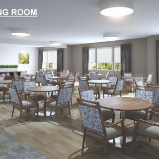 Spacious dining room with multiple tables and chairs, featuring modern lighting and decor.