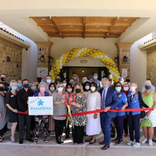 Community members gather for the grand opening and ribbon cutting ceremony.