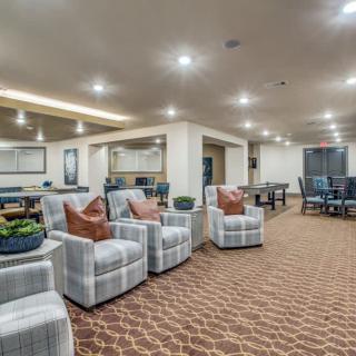 Modern lounge area with comfortable seating and warm lighting.