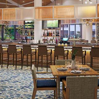 A modern bar and restaurant interior with a stylish seating area.
