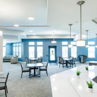 A modern and spacious lounge area with comfortable seating and stylish lighting.