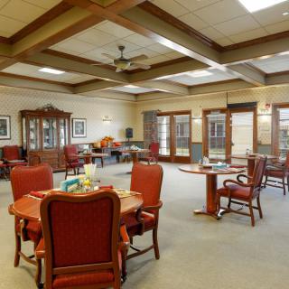 Spacious dining area with elegant furniture and natural lighting.
