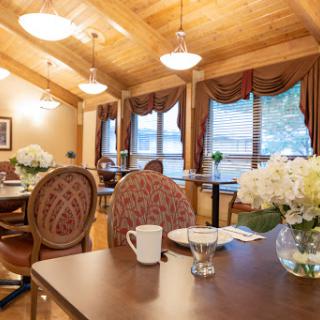 A cozy dining area with elegant decor and natural light.