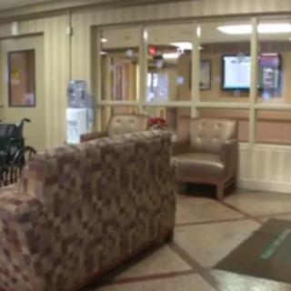A cozy lobby area with sofas and chairs arranged for seating.