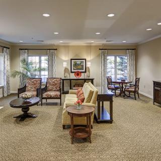 A cozy and well-decorated living room with comfortable seating and natural light.