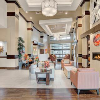A stylish and modern hotel lobby featuring comfortable seating and elegant decor.