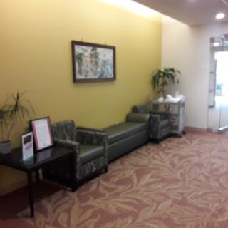 A cozy waiting area featuring comfortable seating and decorative elements.
