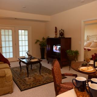Cozy living room with comfortable seating, a television, and decorative accents.