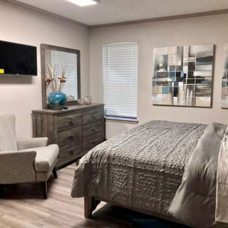 A modern bedroom with stylish decor and comfortable furniture.