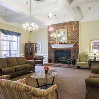 A cozy living room featuring a fireplace and comfortable seating.