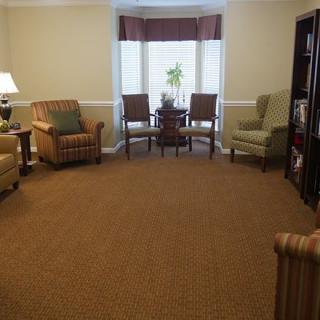 A cozy living room with comfortable seating and a window view.
