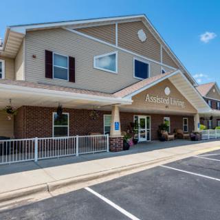 A welcoming entrance to a senior living community, showcasing modern architecture and inviting atmosphere.