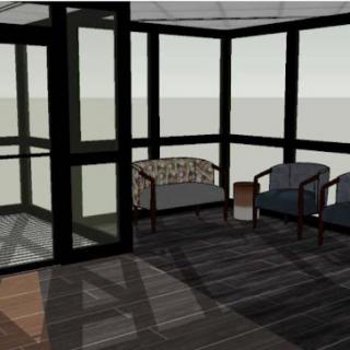 A modern sunroom featuring comfortable seating and large glass windows.