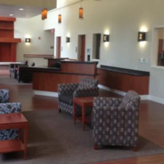 A modern lobby with comfortable seating and reception desks.