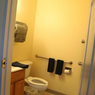 A clean and simple bathroom featuring essential amenities.