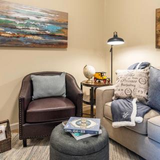 A cozy living room corner with stylish furniture and decor.