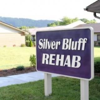Sign for Silver Bluff Rehab in front of a healthcare facility.