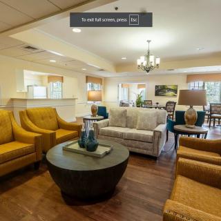 A cozy living room with comfortable seating and elegant decor.