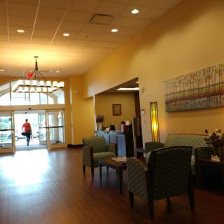 A bright and inviting lobby area with comfortable seating and natural light.
