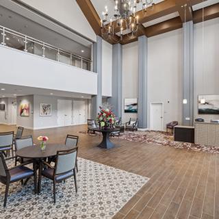 Spacious lobby with elegant decor and high ceilings.