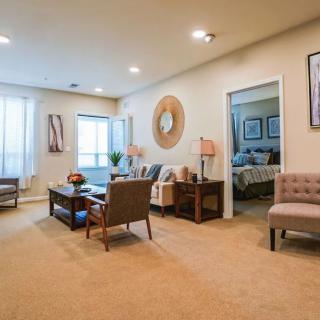 A modern living room with stylish furniture and neutral decor.