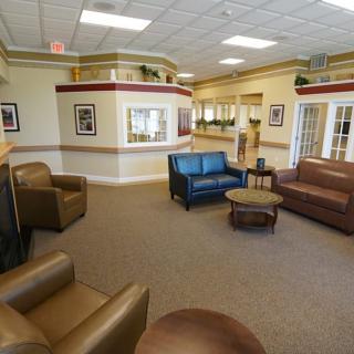 A spacious and well-furnished lobby area with sofas and armchairs.