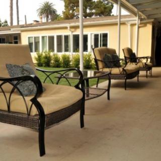 A cozy patio area with cushioned chairs perfect for relaxation.