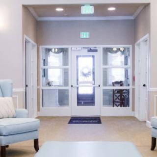 A modern lobby area with comfortable seating and bright lighting.