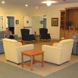 A cozy living room with comfortable seating and a central coffee table.