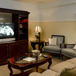A cozy living room with comfortable seating and a television.