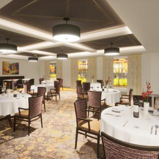 An elegant dining area with round tables, neatly set for guests, featuring stylish lighting and decor.