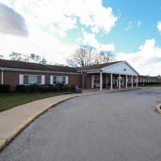 A view of an educational building on a cloudy day.
