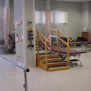 A physical therapy clinic equipped with rehabilitation tools and exercise equipment.