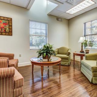 A cozy waiting room with comfortable seating and natural light.
