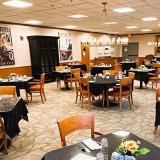 A cozy restaurant dining area with neatly arranged tables and chairs.