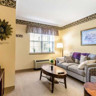 Cozy living room with a sofa, coffee table, and decorative lamp.
