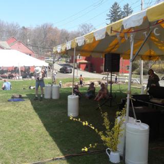 A vibrant outdoor festival setup with colorful tents, inviting guests to enjoy a day of community and celebration.